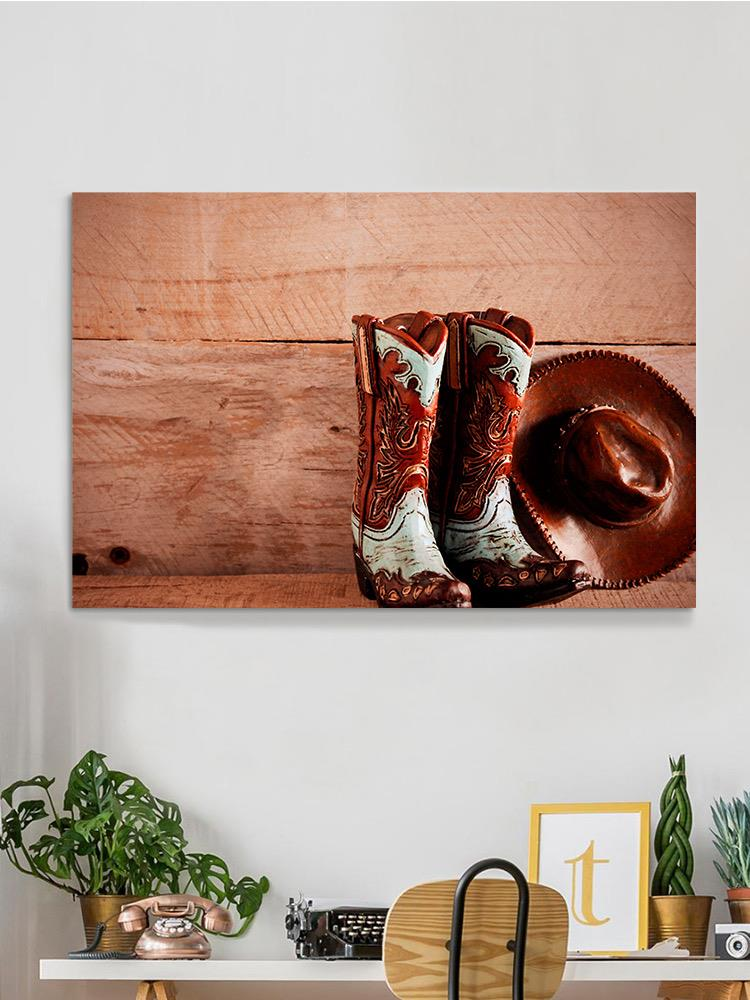 Cowboy Boots And Hat Wrapped Canvas -Image by Shutterstock